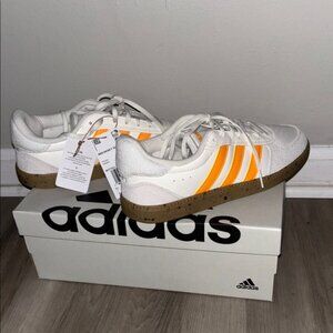Adidas White and Orange Athletic Shoes with Classic Stripes